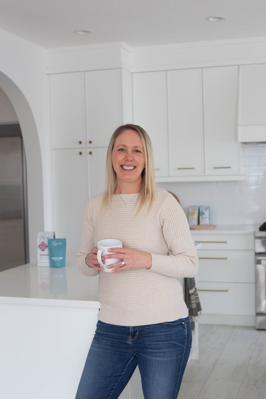 Tara Duncan, founder of Urban Calm Coffee, holding a coffee mug