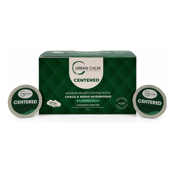 Centered medium roast mushroom coffee K-Cup box and pods on white
