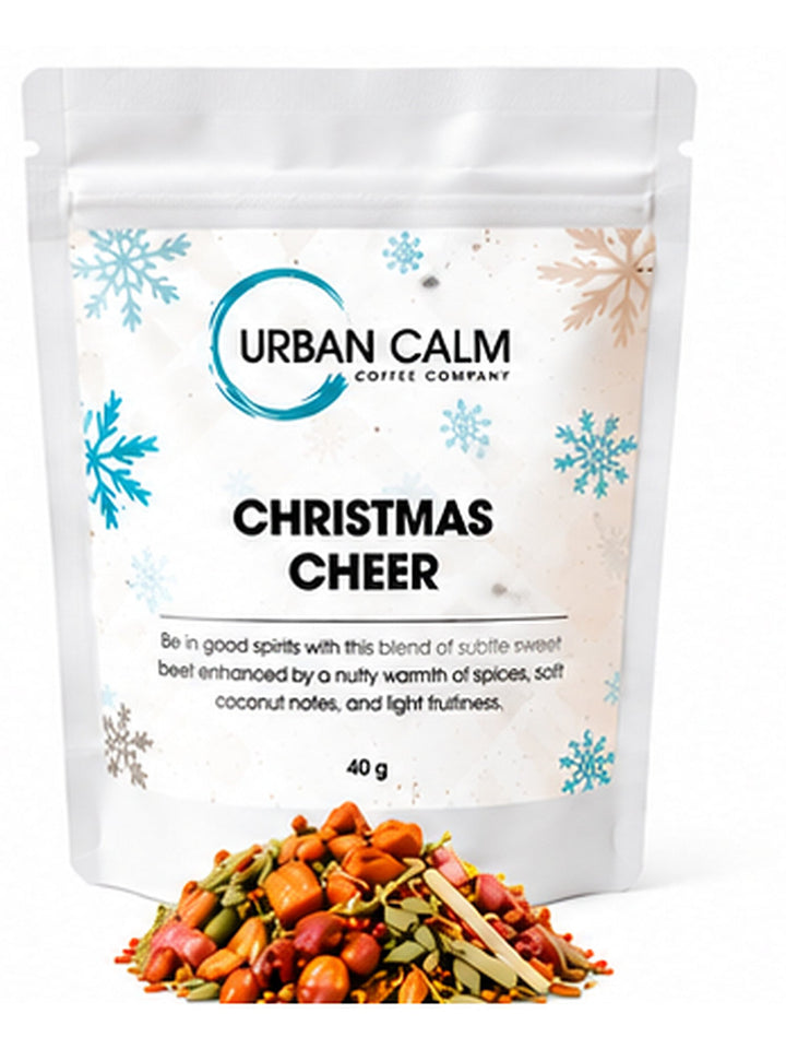 Urban Calm christmas cheer pouch with matching ingredients on clean white background, 3:4 portrait