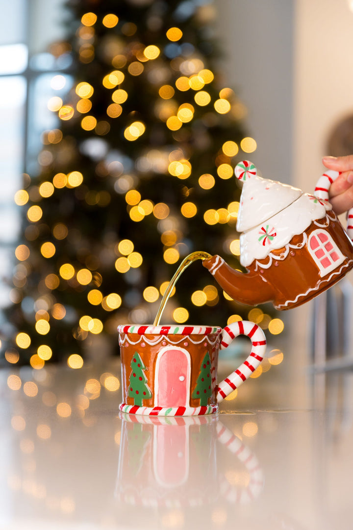 Festive Urban Calm holiday tea being poured into a gingerbread mug